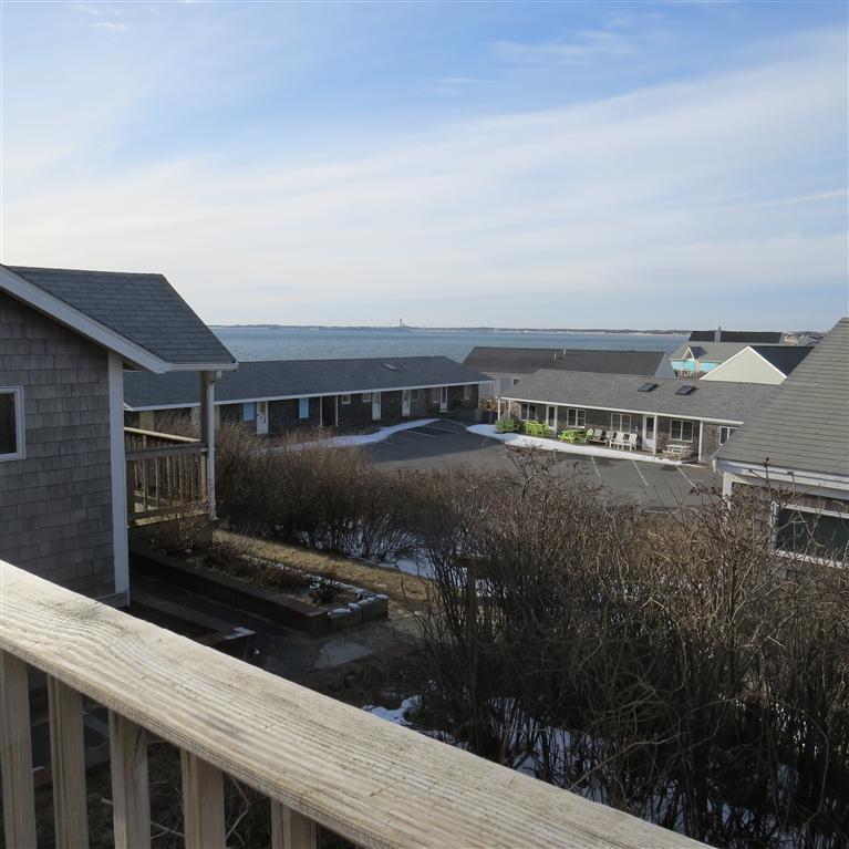 168 Shore Road, Unit 10 Truro, MA 02666 - Photo 5 of 9 a view of a house with backyard