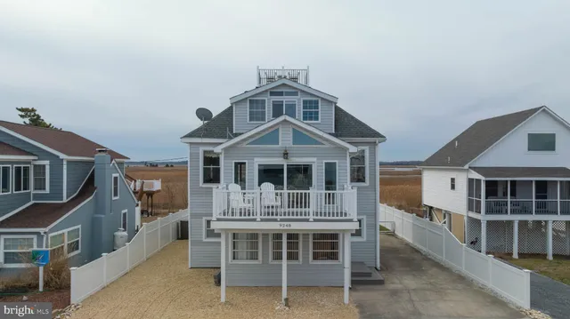 a front view of residential houses with outdoor space