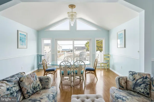 a bedroom with furniture and wooden floor