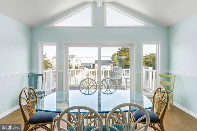 a living room with furniture and a ceiling fan