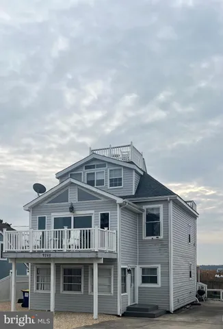 a front view of a house with a lot of buildings