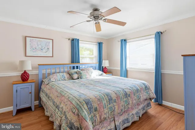 a bedroom with a large bed and a large window