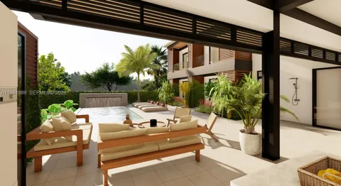 a view of a patio with a table chairs and a potted plant