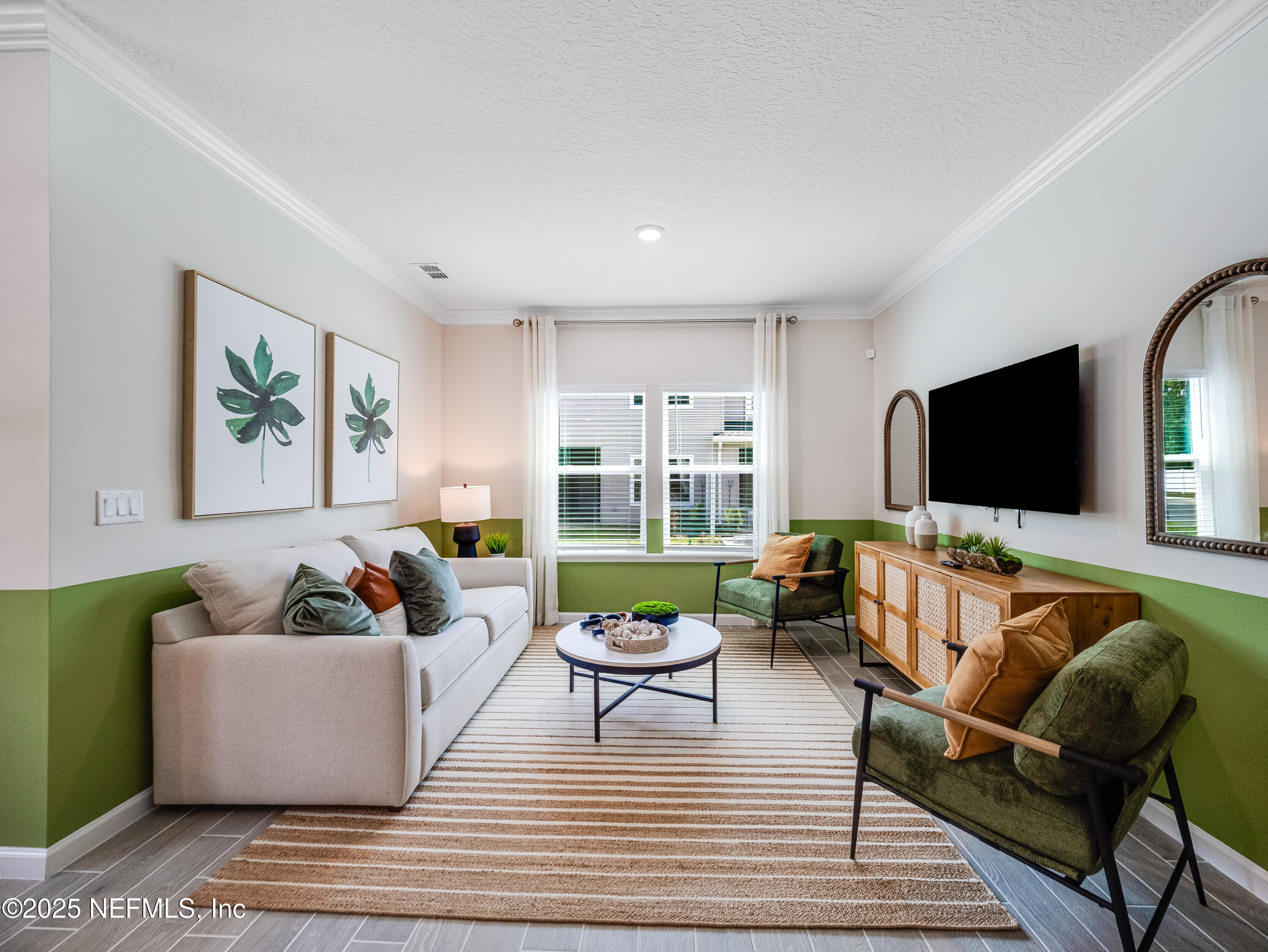 131 Hubbard Bend St. Augustine, FL 32092 - Photo 22 of 42 a living room with furniture and a flat screen tv