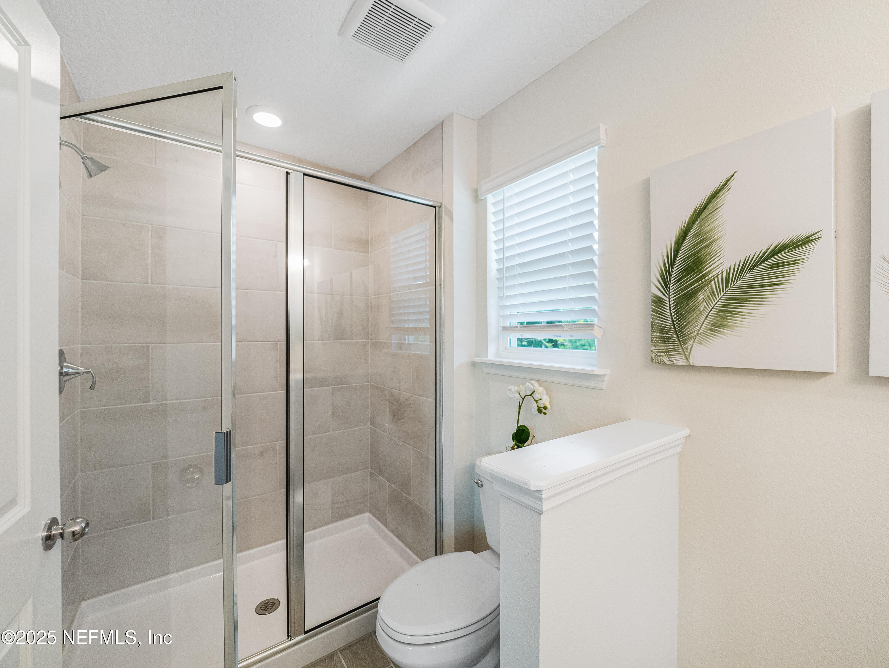 131 Hubbard Bend St. Augustine, FL 32092 - Photo 28 of 42 a bathroom with a shower a sink a toilet and a shower