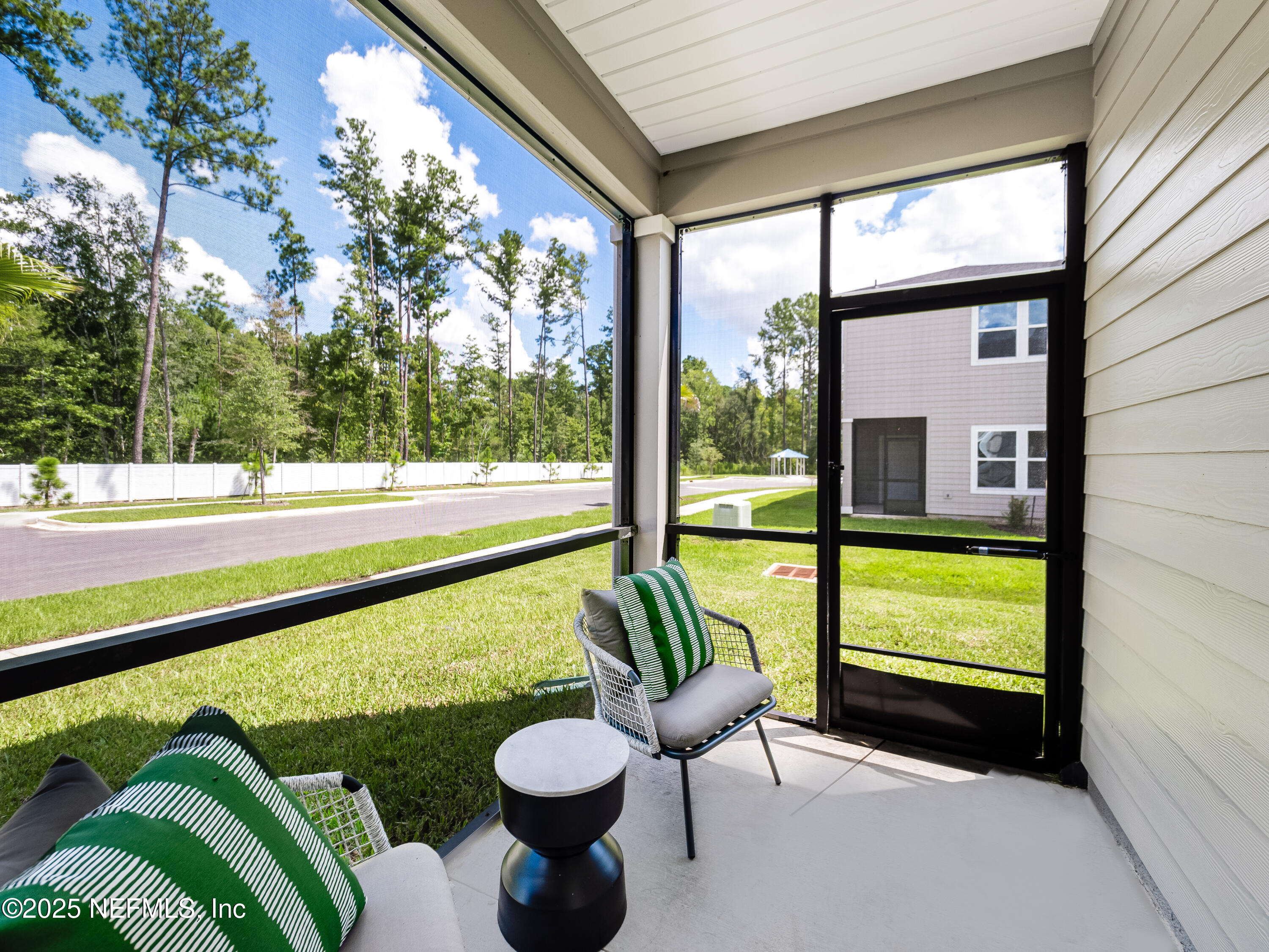 131 Hubbard Bend St. Augustine, FL 32092 - Photo 35 of 42 a view of a porch with furniture and a backyard