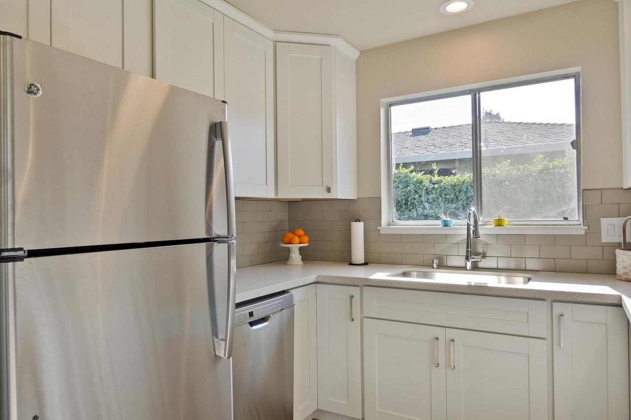 805 Devoto Street Mountain View, CA 94041 - Photo 12 of 26 a white refrigerator freezer sitting in a kitchen