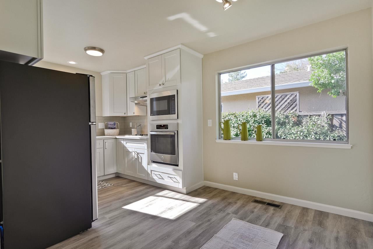 805 Devoto Street Mountain View, CA 94041 - Photo 15 of 26 a kitchen with white cabinets and appliances