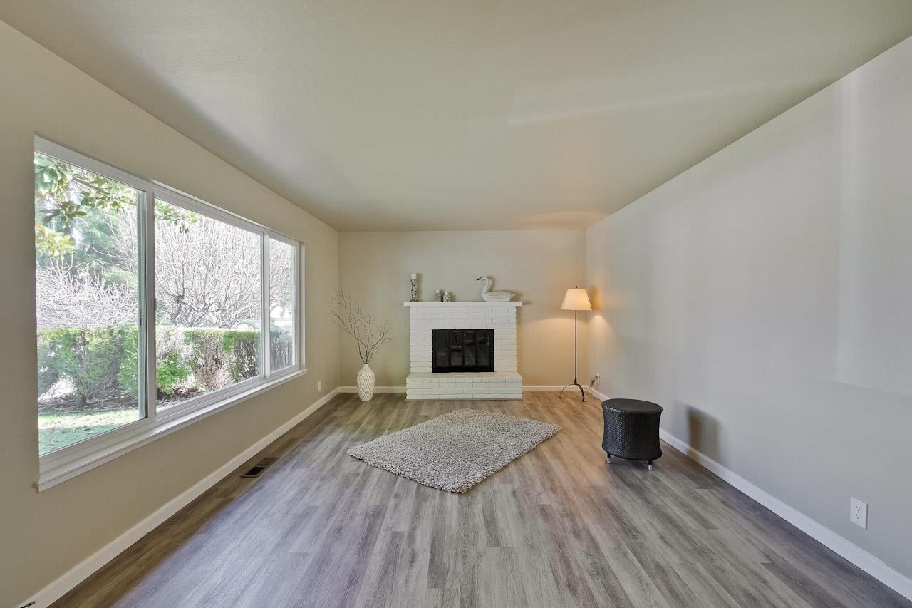 805 Devoto Street Mountain View, CA 94041 - Photo 4 of 26 a view of an empty room with a window and wooden floor