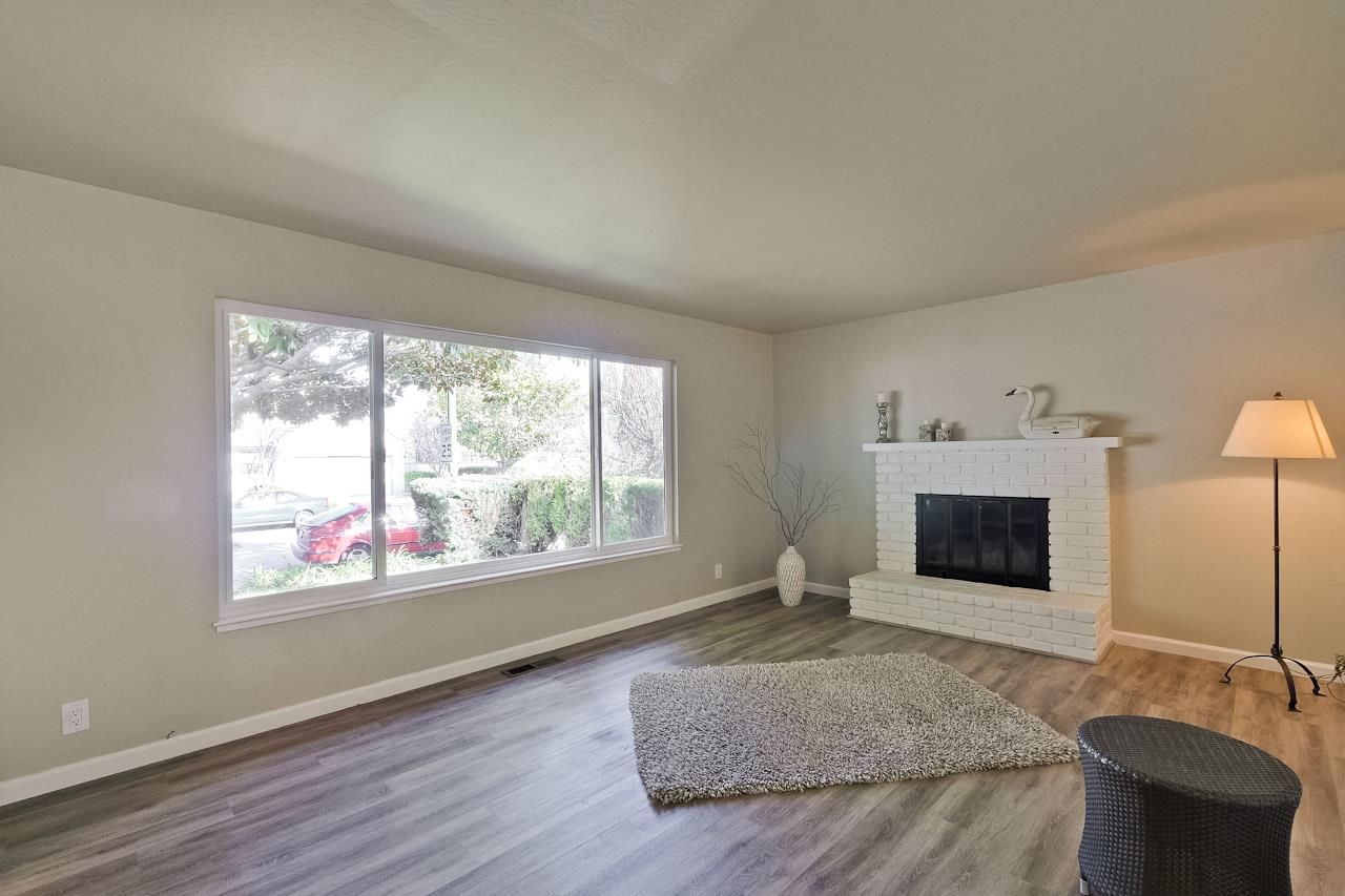 805 Devoto Street Mountain View, CA 94041 - Photo 6 of 26 a living room with furniture and a fireplace