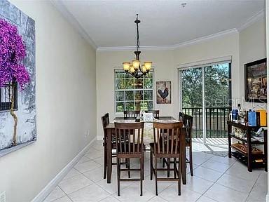 8263 Miramar Way Lakewood Ranch, FL 34202 - Photo 11 of 54 a view of a dining room with furniture window and outside view