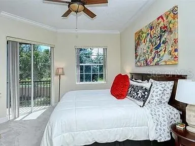 a bedroom with a bed and window