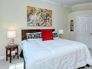 8263 Miramar Way Lakewood Ranch, FL 34202 - Photo 18 of 54 a bedroom with a bed and a painting on the wall