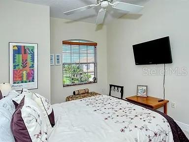 8263 Miramar Way Lakewood Ranch, FL 34202 - Photo 22 of 54 a bedroom with a bed and a flat screen tv