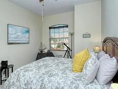 a bedroom with a bed and dresser