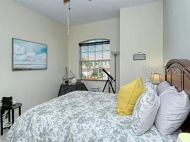 8263 Miramar Way Lakewood Ranch, FL 34202 - Photo 24 of 54 a bedroom with a bed and dresser