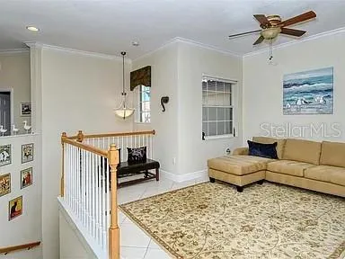 a living room with furniture and a rug
