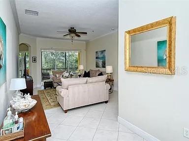 8263 Miramar Way Lakewood Ranch, FL 34202 - Photo 3 of 54 a living room with furniture and chandelier