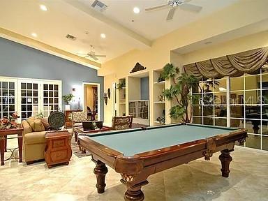8263 Miramar Way Lakewood Ranch, FL 34202 - Photo 37 of 54 a living room with furniture pool table and a flat screen tv