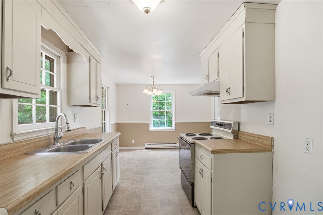 14527 Arwood Road Disputanta, VA 23842 - Photo 10 of 20 a kitchen that has a sink and a stove in it