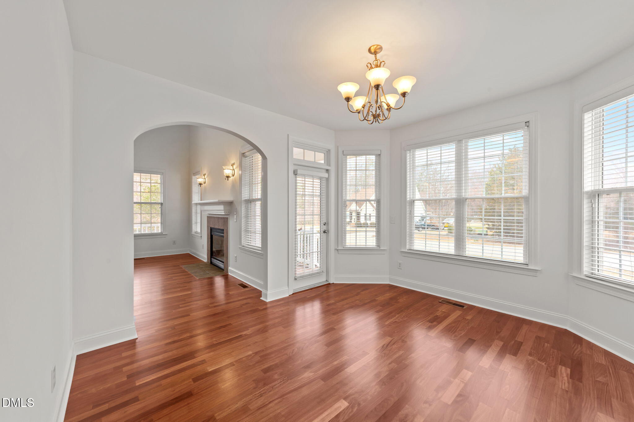 7101 Numa Circle Willow Spring, NC 27592 - Photo 9 of 44 a view of an empty room with wooden floor and a window