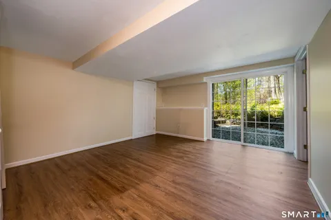 a view of a chairs and table in the balcony