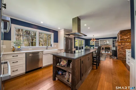 a kitchen with stainless steel appliances granite countertop lots of counter top and sink