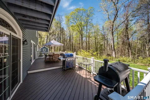 a view of a backyard with a patio and outdoor seating