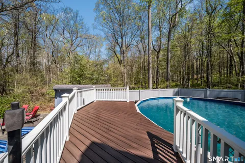 a backyard of a house with table and chairs