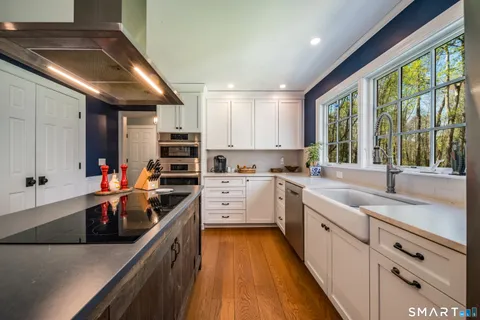 a kitchen that has a sink and a stove