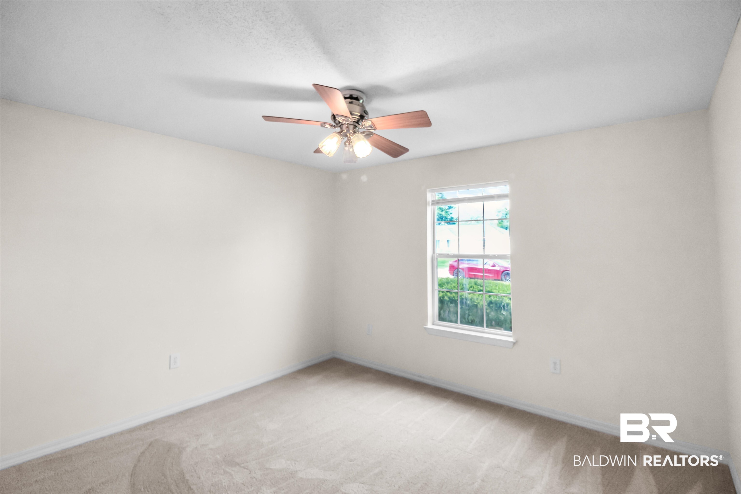 8940 Caitlin Street Foley, AL 36535 - Photo 13 of 27 Spare room with light carpet and ceiling fan
