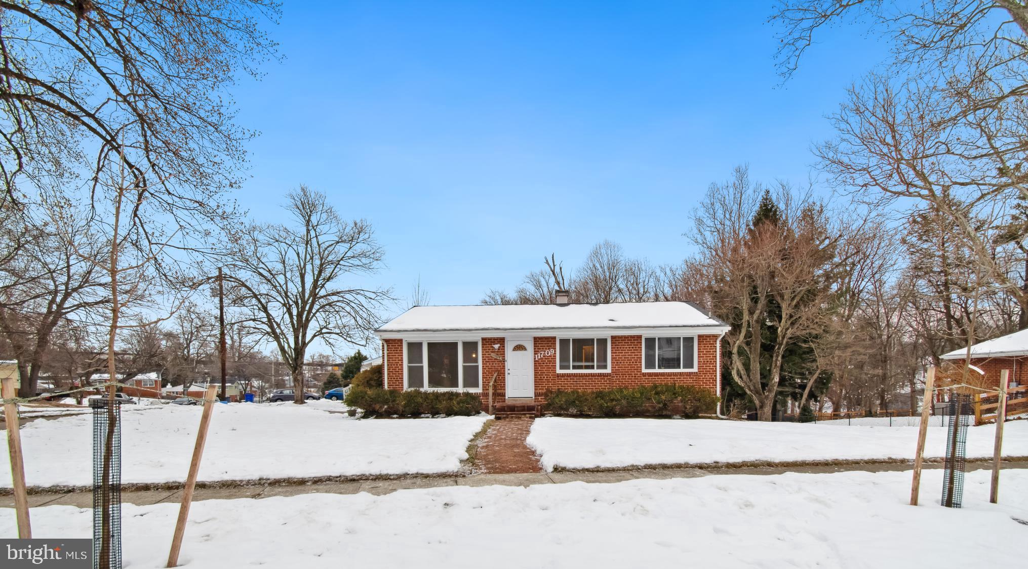 11709 Mentone Road Silver Spring, MD 20906 - Photo 2 of 4 a front view of a house with a yard