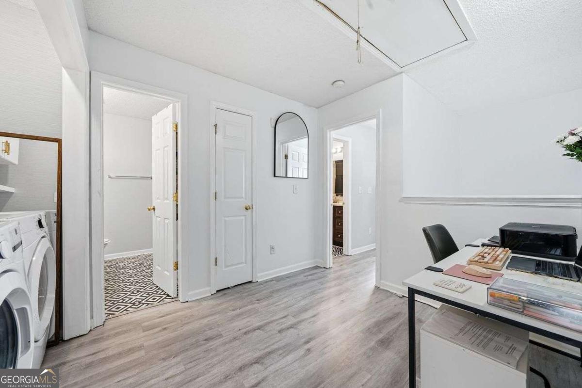 166 Odyssey Conyers, GA 30012 - Photo 20 of 42 a view of workspace with wooden floor