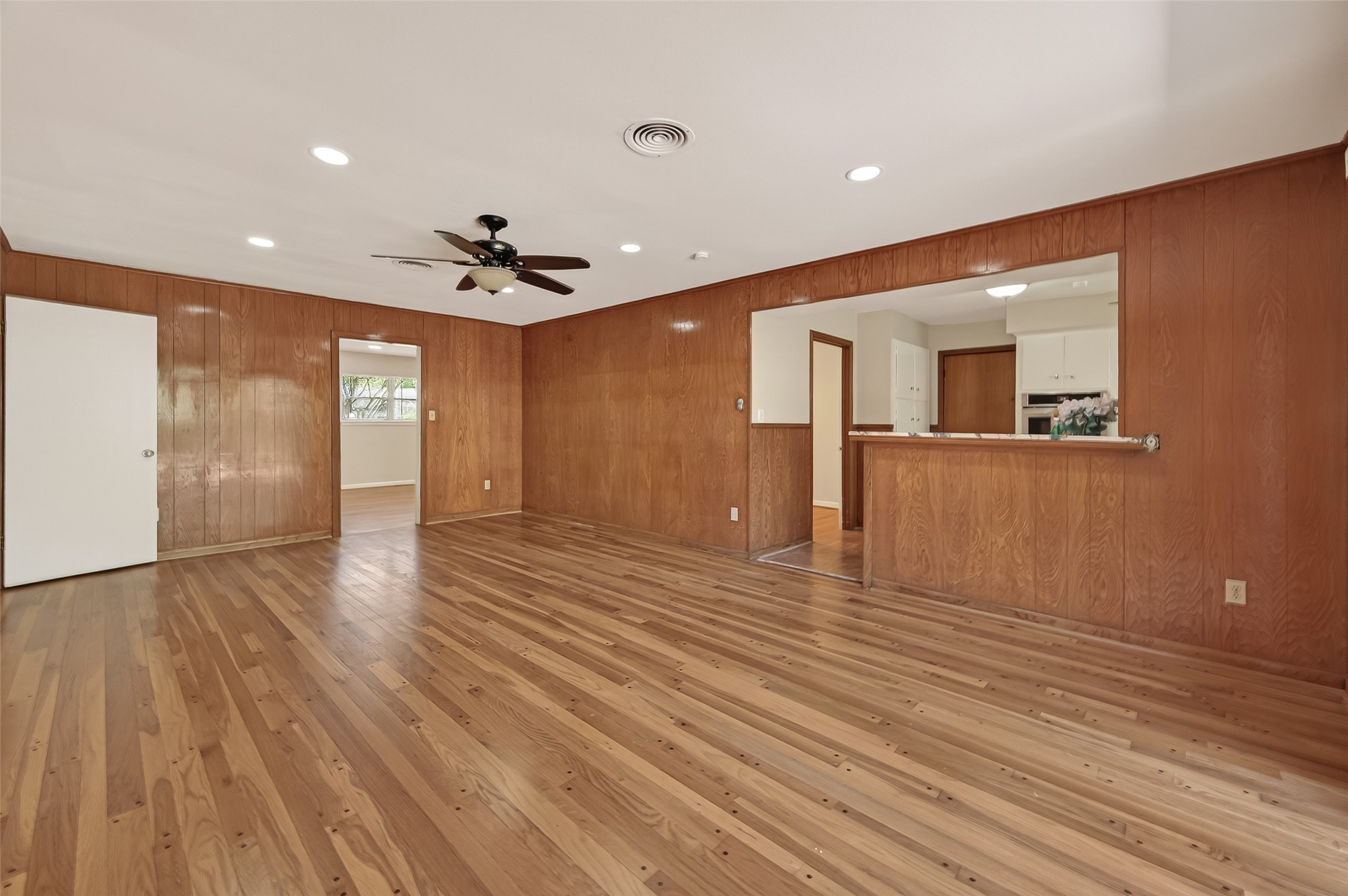 5646 Hazen Street Houston, TX 77081 - Photo 13 of 43 The secondary living room flows seamlessly into the kitchen, creating an ideal space for daily living and entertaining.