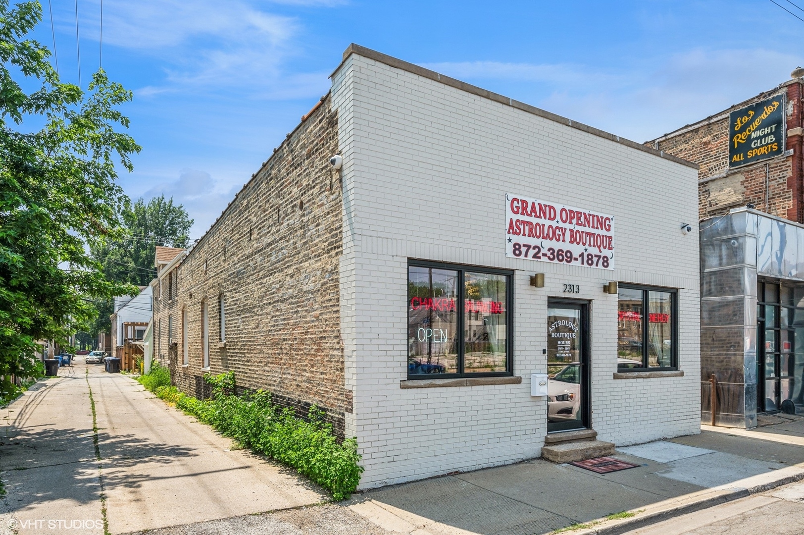 2313 West Fullerton Avenue Chicago, IL 60647 - Photo 1 of 25 a front view of a building with retail shops