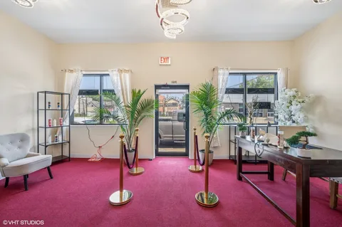 a living room with furniture a window and plants