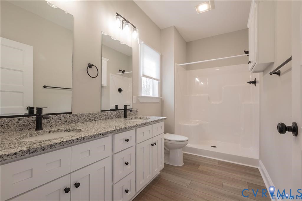 2223 Ridge Road Arvonia, VA 23004 - Photo 23 of 32 Bathroom featuring a dual vanity with a speckled c