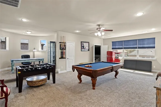 a living room with furniture a piano and a chandelier
