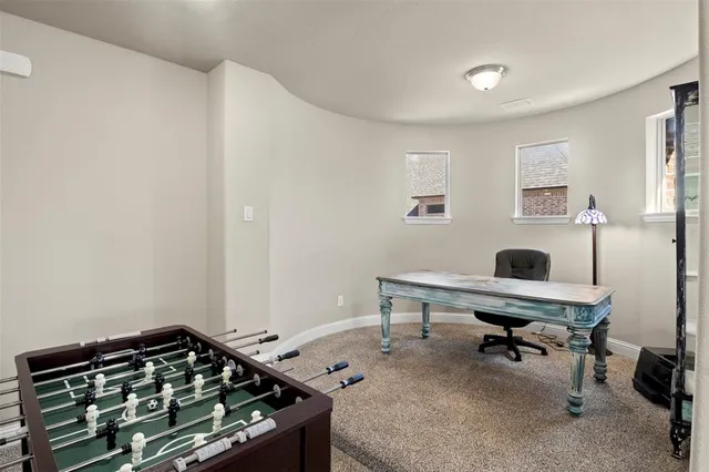 a bedroom with a workspace