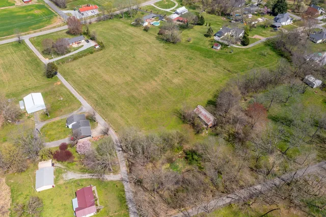 a aerial view of a house with a yard