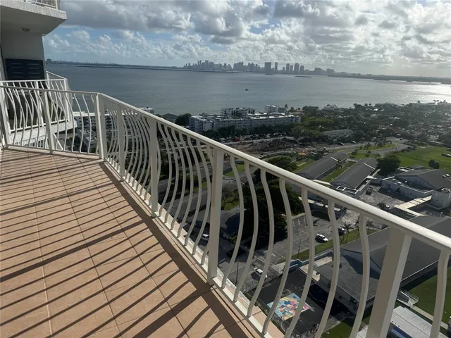a view of balcony with furniture
