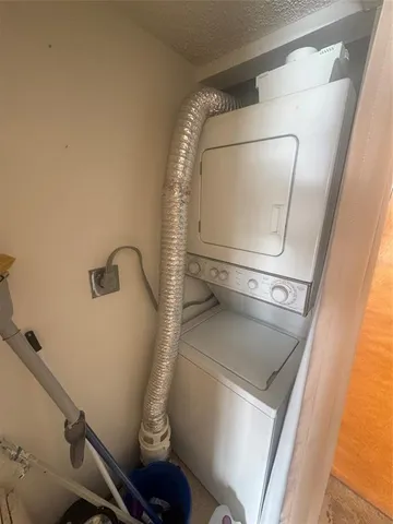 a view of empty room with wooden floor and floor to ceiling window