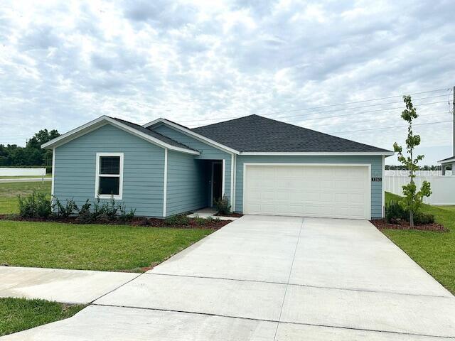 1283 Northwest 44th Court Road Ocala, FL 34482 - Photo 1 of 1 a front view of a house with a yard and garage
