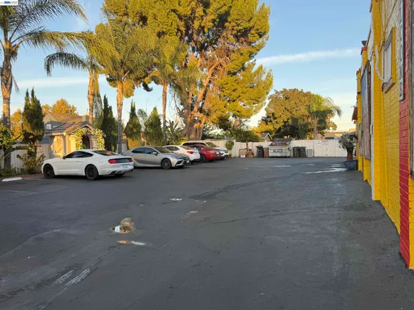 a view of street with parked cars