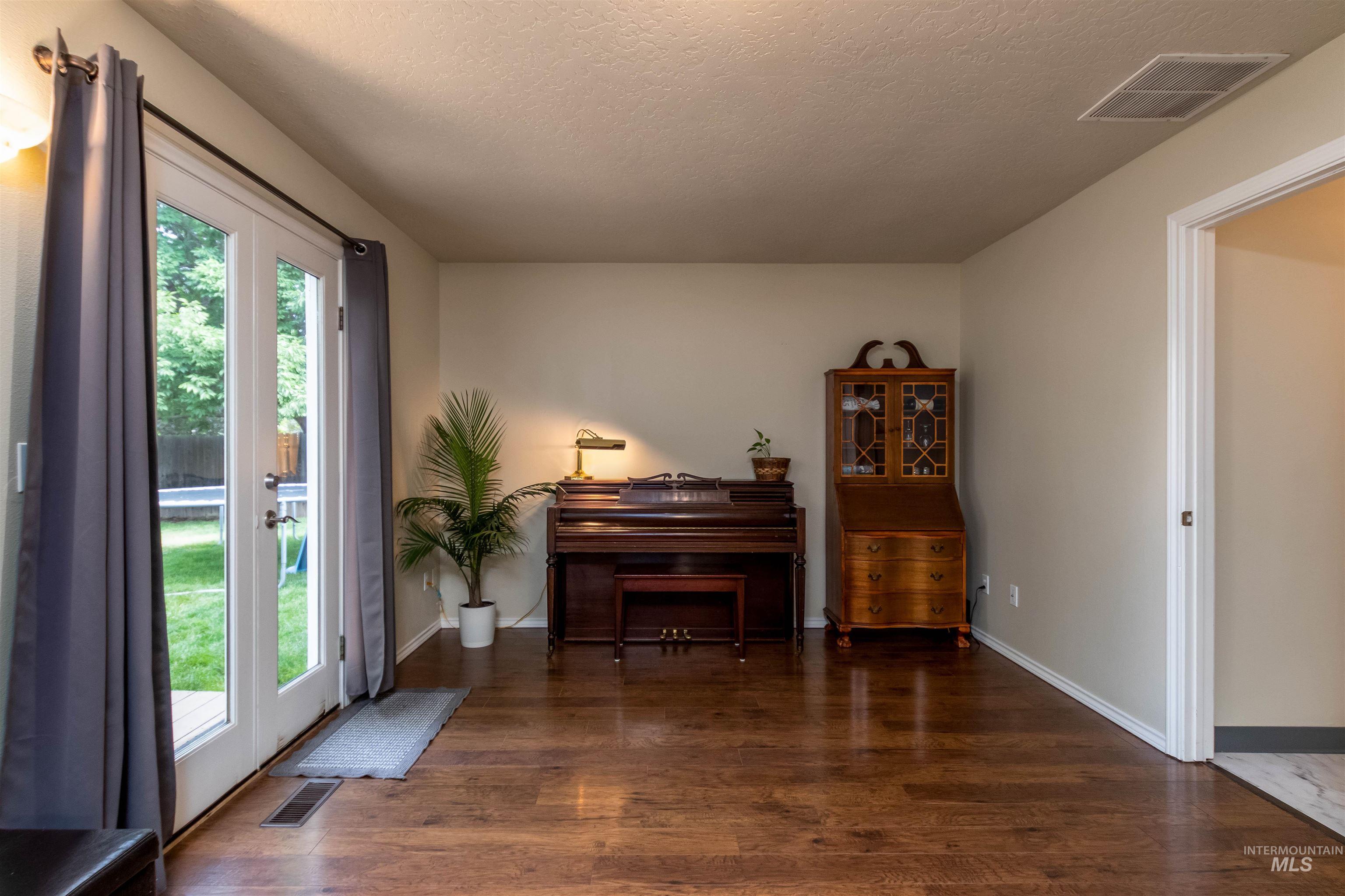 485 North Nebula Avenue Star, ID 83669 - Photo 11 of 47 Foyer featuring wood finished floors and a textured ceiling