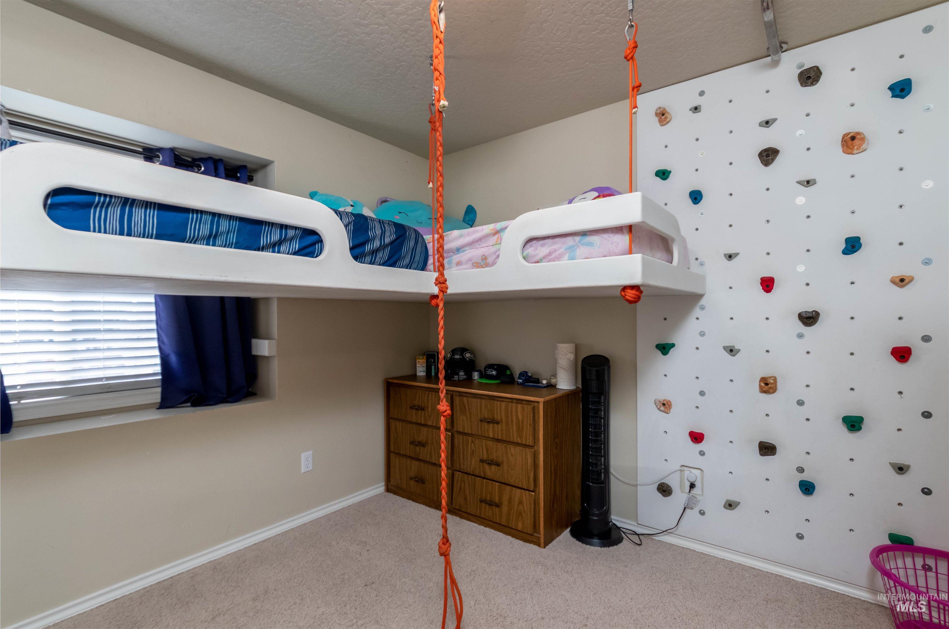 485 North Nebula Avenue Star, ID 83669 - Photo 14 of 47 Carpeted bedroom with baseboards and a textured ceiling