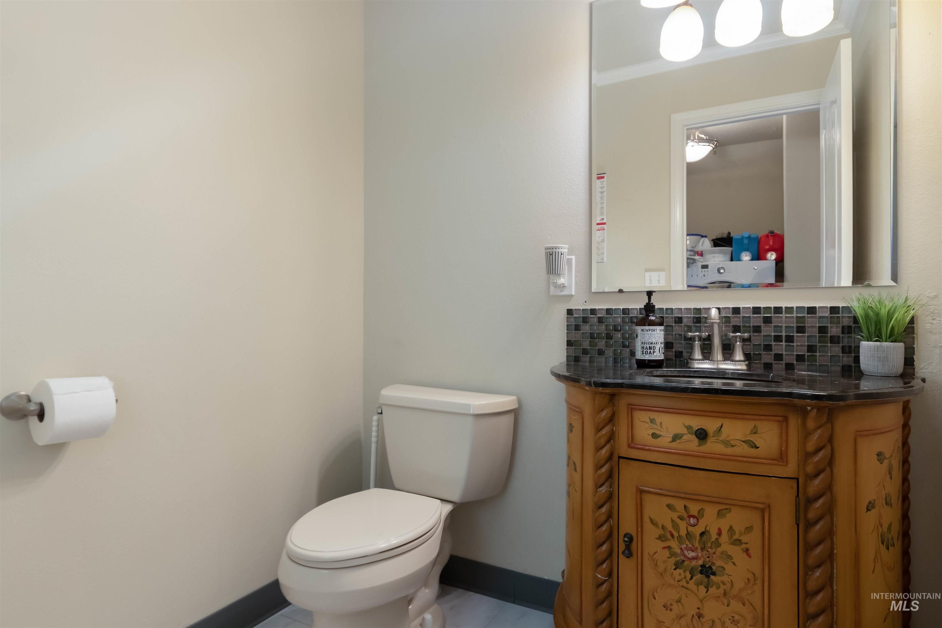 485 North Nebula Avenue Star, ID 83669 - Photo 19 of 47 Bathroom with tasteful backsplash, vanity, and ornamental molding