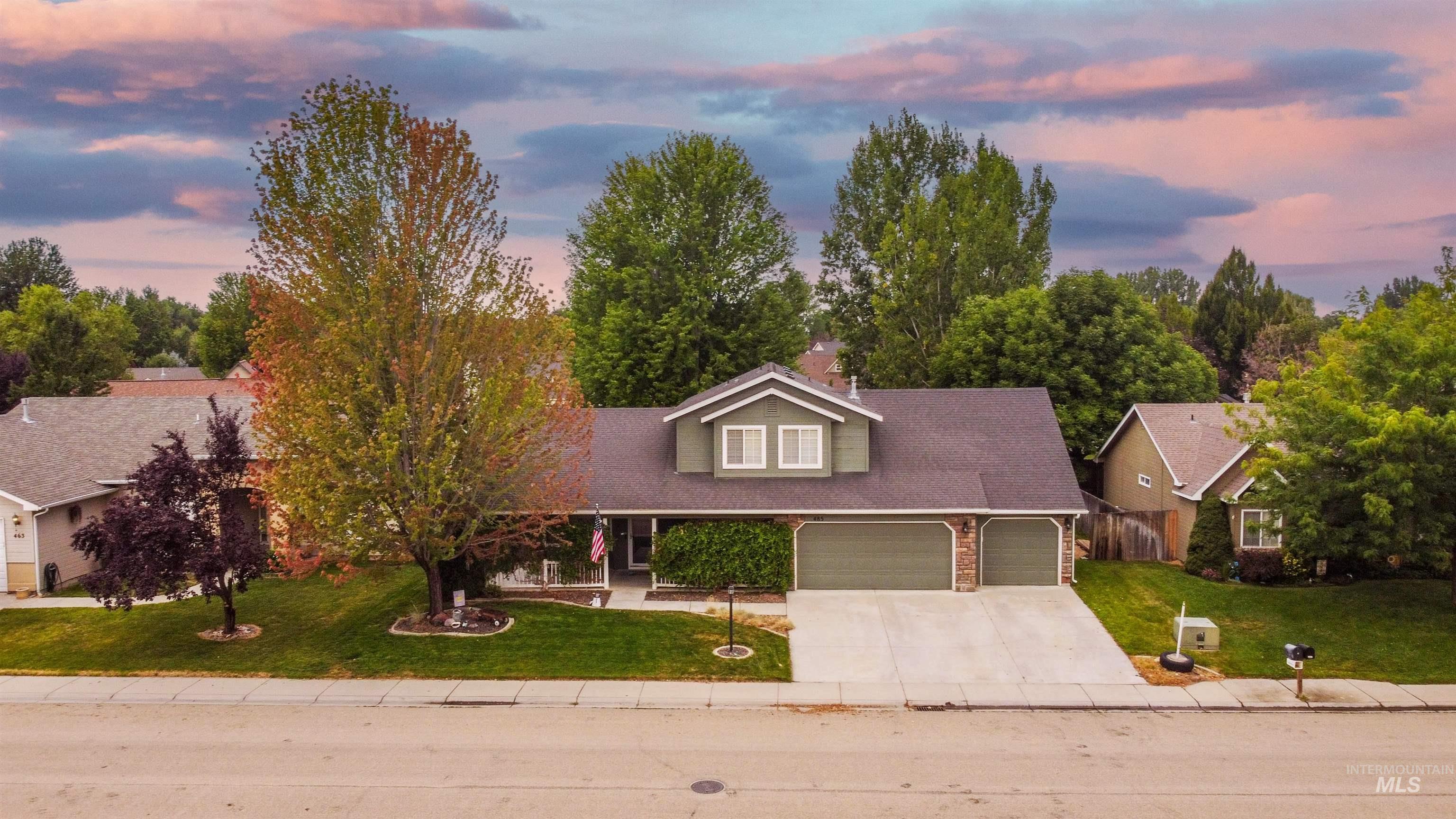 485 North Nebula Avenue Star, ID 83669 - Photo 2 of 47 View of front of home with a garage, a lawn, and driveway