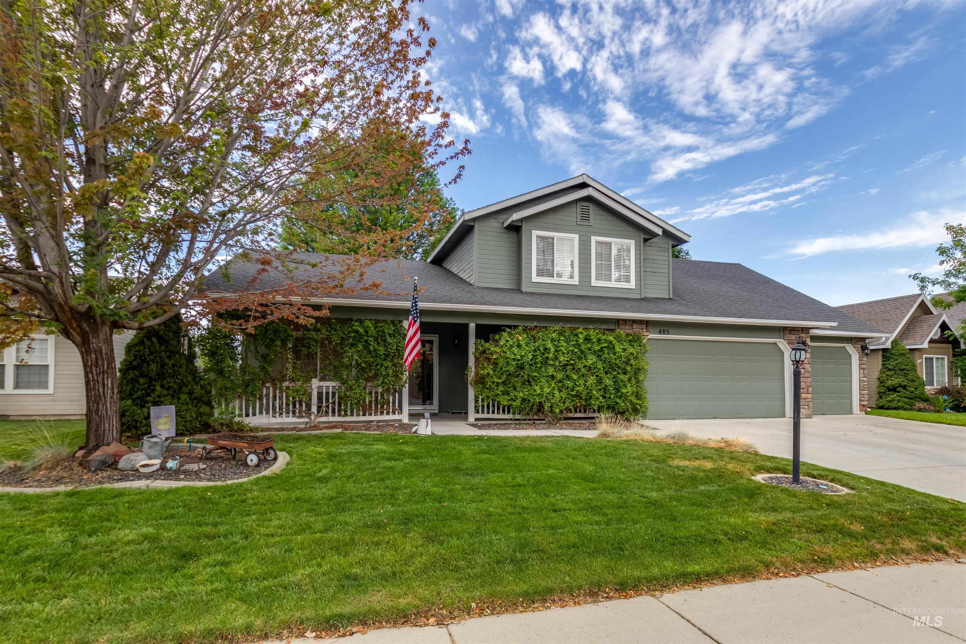 485 North Nebula Avenue Star, ID 83669 - Photo 26 of 47 Traditional-style home featuring a front lawn, concrete driveway, an attached garage, and a shingled roof