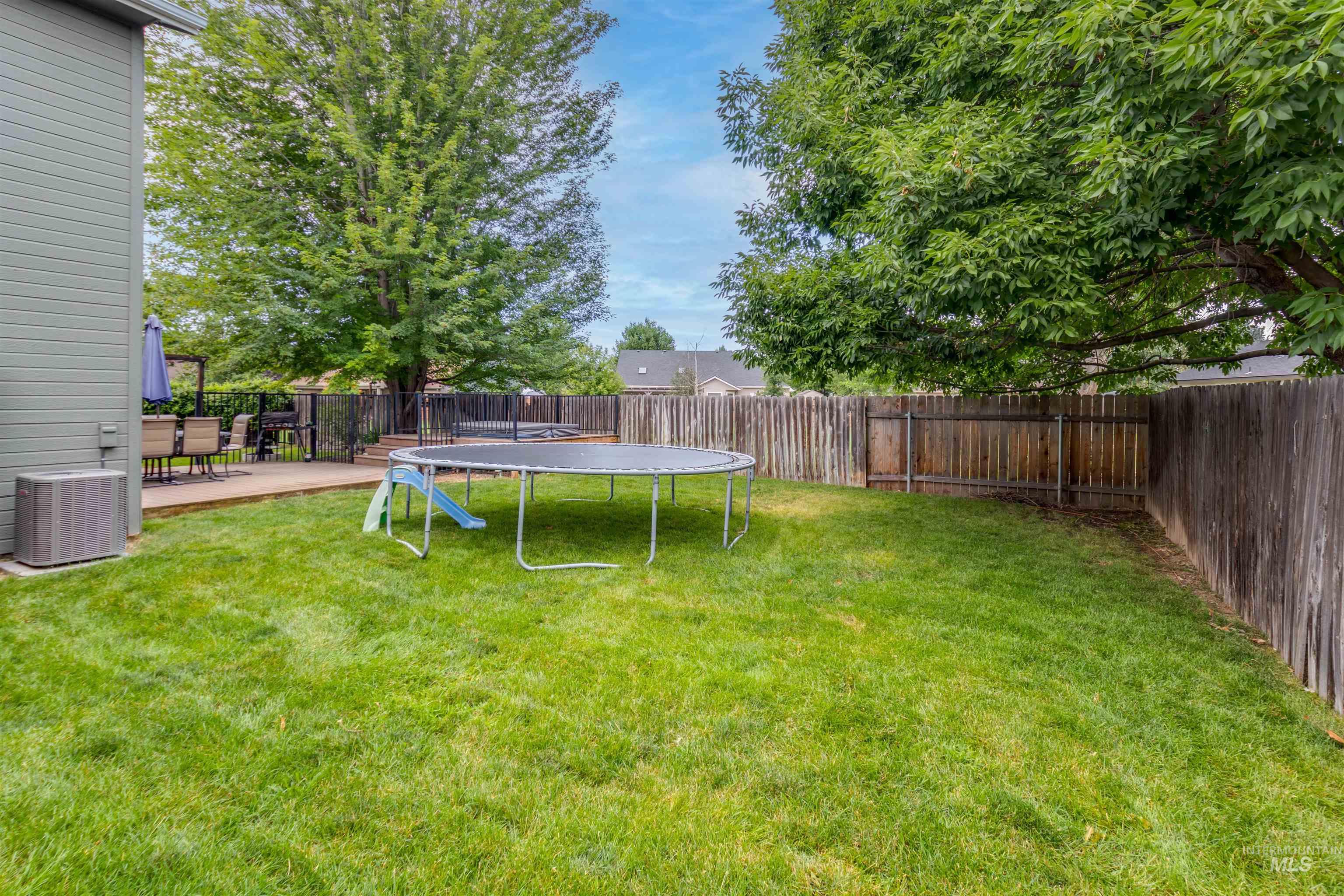 485 North Nebula Avenue Star, ID 83669 - Photo 29 of 47 Fenced backyard featuring a trampoline